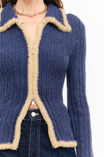 Load image into Gallery viewer, Close-up of The Aspen Double Zip Knit Cardigan featuring a ribbed navy knit, contrast fuzzy trim, fold-over collar, and functional double zipper.
