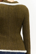 Load image into Gallery viewer, Close-up of olive green textured knit sweater top featuring an ivory fuzzy-trimmed pointed collar, two-way silver zipper, fitted waist, and contrasting ivory trim.
