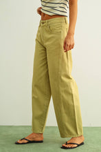 Load image into Gallery viewer, Olive green high-rise wide-leg jeans with relaxed barrel silhouette styled with sandals for an effortless everyday look.
