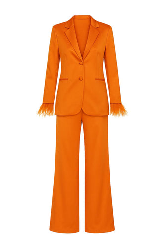 Orange suit with feather wrist cuffs on a white background
