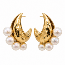 Load image into Gallery viewer, Oversized sculptural gold-tone crescent earrings with a hammered high-shine finish and clusters of large white pearl accents.
