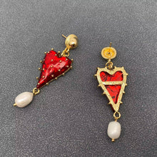 Load image into Gallery viewer, Red strawberry heart statement earrings with gold-tone details and dangling white pearl accents.
