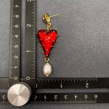 Load image into Gallery viewer, Red strawberry heart statement earrings with gold-tone details and dangling white pearl accents.
