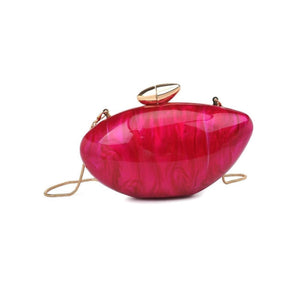Pink handbag with gold accents on a white background