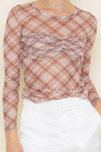 Plaid long-sleeve top with a knot detail on a plain background