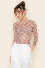 Load image into Gallery viewer, Woman wearing a plaid blouse with a plain background
