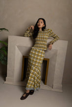 Load image into Gallery viewer, Yellow plaid midi skirt with lace trim hem worn by model.
