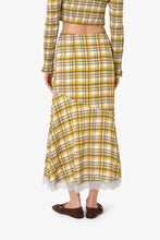 Load image into Gallery viewer, Yellow plaid midi skirt with lace trim hem worn by model.
