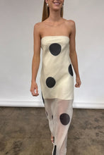 Load image into Gallery viewer, Woman wearing a strapless dress with black polka dots on a plain background
