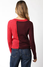 Load image into Gallery viewer, Person wearing a red and burgundy color-blocked sweater with blue jeans from Glam Expressway, a fun fashion forward boutique in DUMBO BRooklyn.
