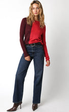 Load image into Gallery viewer, Woman wearing a red sweater and blue jeans from Glam Expressway, a fun, fashion-forward boutique in DUMBO Brooklyn. 
