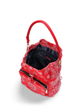 Load image into Gallery viewer, Red bandana print convertible bucket bag with drawstring closure and adjustable straps that can be worn as a backpack, shoulder bag, or crossbody bag.
