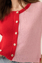 Load image into Gallery viewer, Red and pink cardigan with button details on a neutral background
