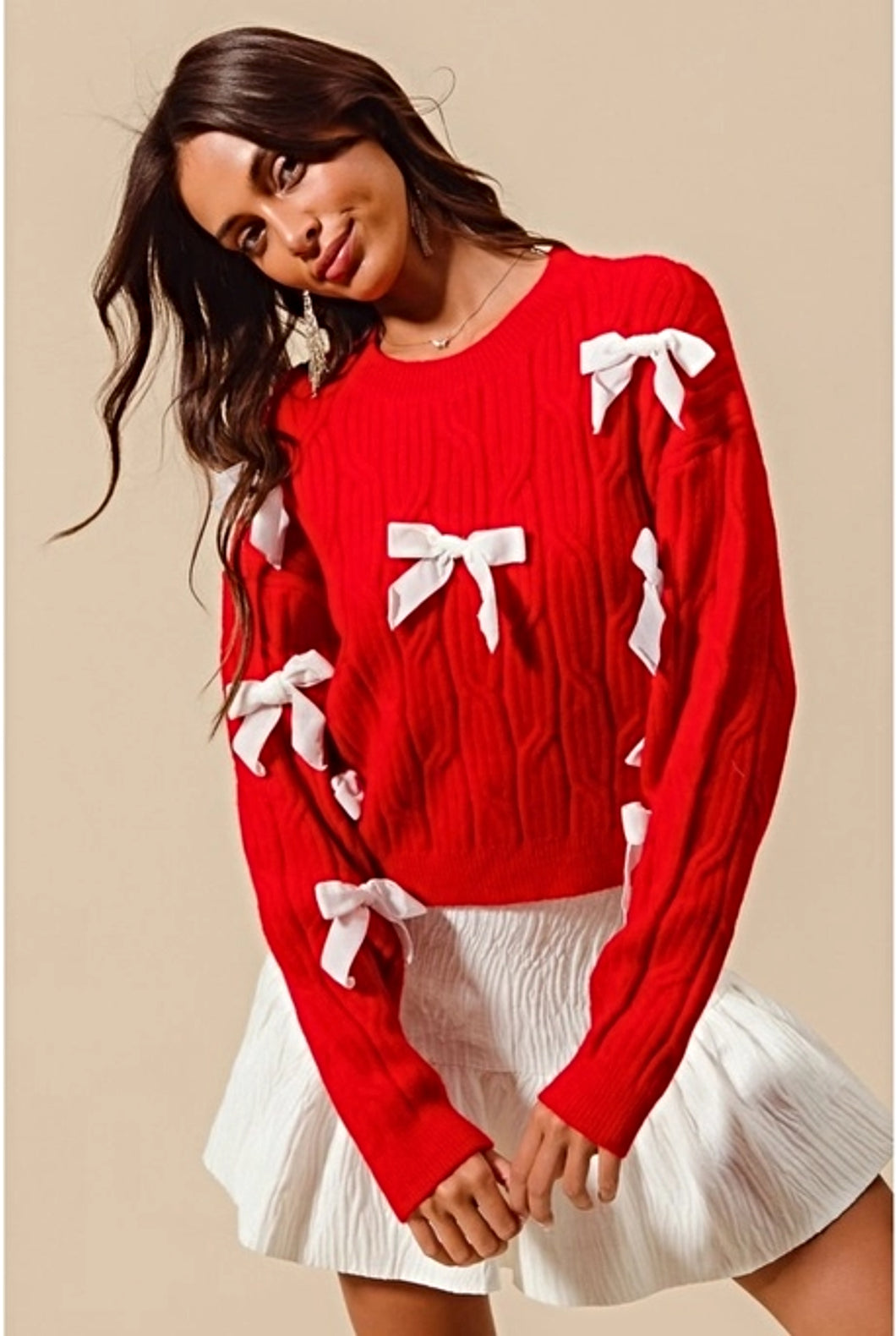 Add a playful pop of color to your wardrobe with our Cherry Red Cable Knit Sweater, adorned with delicate white ribbon bow appliqués! This cozy yet statement-making sweater features a classic cable knit design in a bold red hue, with charming white bows adding a whimsical touch. Perfect for pairing with jeans or a skirt, this sweater will keep you warm and stylish all season long. Available in sizes S to XL for the perfect fit!