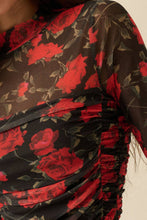 Load image into Gallery viewer, Close-up of a black fabric with red floral pattern
