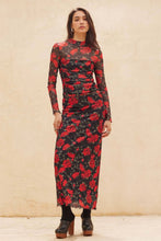 Load image into Gallery viewer, Woman wearing a black skirt and matvhing bodysuit with red floral pattern against a beige background
