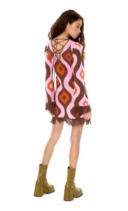 Glam Expressway's multi colored Fringe Knit Mini Dress is perfect for the season with a groovy new psychedelic pink and brown print, a lace-up back and a brown fringe trim. This fun dress is a wardrobe must have, made with 100% organic cotton for a cosy a luxurious feel. Wear the Fringe Knit Mini Dress whenever you want to stand out!
