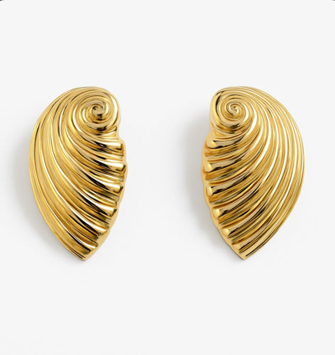 Pair of sculpted gold shell earrings with a polished, swirling, textured design displayed on a clean white background