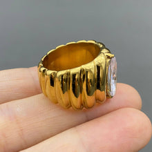 Load image into Gallery viewer, 18K gold-plated stainless steel statement ring with a large sparkling marquise-cut zircon center stone and sculpted ridged band.
