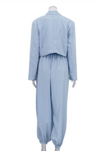 Load image into Gallery viewer, Sky blue two-piece set featuring a cropped two-button blazer and matching high-waisted balloon pants with gathered ankles.
