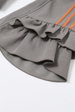 Load image into Gallery viewer, Dark gray fitted zip-up hoodie with orange sleeve stripes, oversized hood and dramatic layered ruffle bell sleeves.

