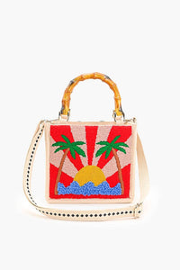 Handbag with a sun and palm tree design on a white background