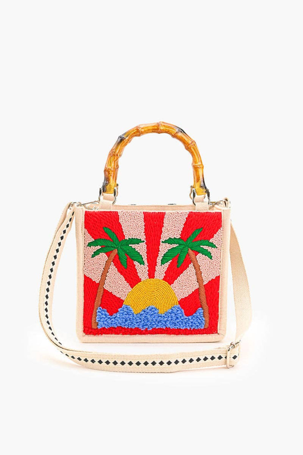 Handbag with a sun and palm tree design on a white background
