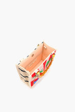 Load image into Gallery viewer, Colorful handbag with floral pattern on a white background
