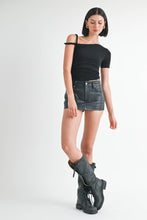 Load image into Gallery viewer, Woman wearing a black top, gray denim skirt, and gray high-heeled boots on a white background
