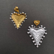 Load image into Gallery viewer, Two-tone heart statement earrings featuring textured 18K gold-plated stainless steel hearts with polished silver-tone accents.
