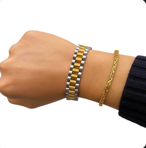 Two tone gold and silver oyster link bracelet displayed on wrist, featuring flexible watch style links. 