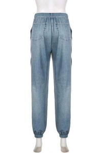 Upgrade your casual wardrobe with these Two-Tone Sweat Pants! Combining the look of denim with the comfort of joggers, these graphic long pants are a Y2K-inspired essential. Featuring a high-rise elastic waistband and a relaxed cargo-style fit, they’re perfect for an effortlessly cool, laid-back vibe.