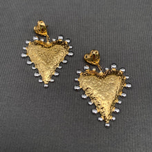 Load image into Gallery viewer, Two-tone heart statement earrings featuring textured 18K gold-plated stainless steel hearts with polished silver-tone accents.
