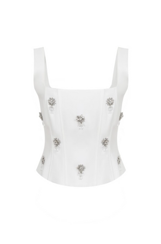 White structured bustier top featuring wide straps and multiple crystal floral embellishments across the front, photographed on a white background.