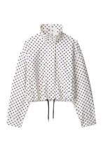 Load image into Gallery viewer, White cropped jacket with black polka dot print, featuring a high collar, long sleeves, and adjustable drawstring hem.
