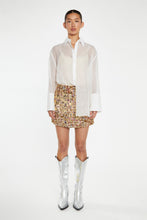 Load image into Gallery viewer, Introducing the White Organza Long Sleeve Button Down Shirt, an elegant and versatile staple for your wardrobe. Crafted from delicate organza, this chic piece effortlessly elevates any outfit. Wear it buttoned up for a polished look or layered over a bralette for a modern, trendy twist. Perfect for any occasion, from the office to an evening out, this shirt is your go-to for instant sophistication.
