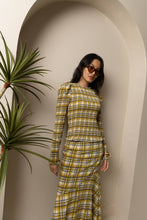 Load image into Gallery viewer, Yellow plaid smocked blouse with ruffle trim and long sleeves worn by model.
