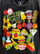 Load image into Gallery viewer, Black oversized graphic t-shirt with colorful food-themed illustration and “You’ve Got Good Taste” text on front.

