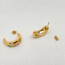 Load image into Gallery viewer, 18K gold-plated C-shaped hoop earrings inlaid with multicolored cubic zirconia stones in pink, purple, green and clear.

