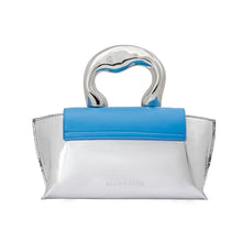 Load image into Gallery viewer, Meet our Silver and Blue Top Handle Bag, one of the most unique and intricate handbags you will find. Made out of recycled vegan leather this metallic top handle bag makes a fashionable yet sustainable statement piece. Wear it comfortably as a crossbody bag using the adjustable strap for hands-free convenience.
