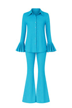 Load image into Gallery viewer, Turquoise bell-sleeve top and flared pants set on a white background
