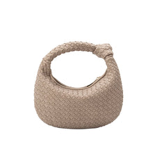 Load image into Gallery viewer, Now in vegan suede, the Woven Leather Mushroom Round Bag continues to be a crowd favorite among trendsetters and lovers of cruelty-free fashion. This utterly luxe yet eco-friendly top-handle handbag is made with recycled vegan suede, so you can show off your style in a sustainable way.
