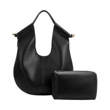 Load image into Gallery viewer, Effortlessly chic and highly functional, the Black Leather Tote Bag is your go-to bag for workdays and weekends alike. Crafted from recycled vegan leather, it features a knotted handle design accented with luxurious gold-tone hardware. Its spacious interior offers ample room for all your essentials, complete with a removable pouch and slip pockets for easy organization.
