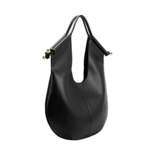 Load image into Gallery viewer, Effortlessly chic and highly functional, the Black Leather Tote Bag is your go-to bag for workdays and weekends alike. Crafted from recycled vegan leather, it features a knotted handle design accented with luxurious gold-tone hardware. Its spacious interior offers ample room for all your essentials, complete with a removable pouch and slip pockets for easy organization.
