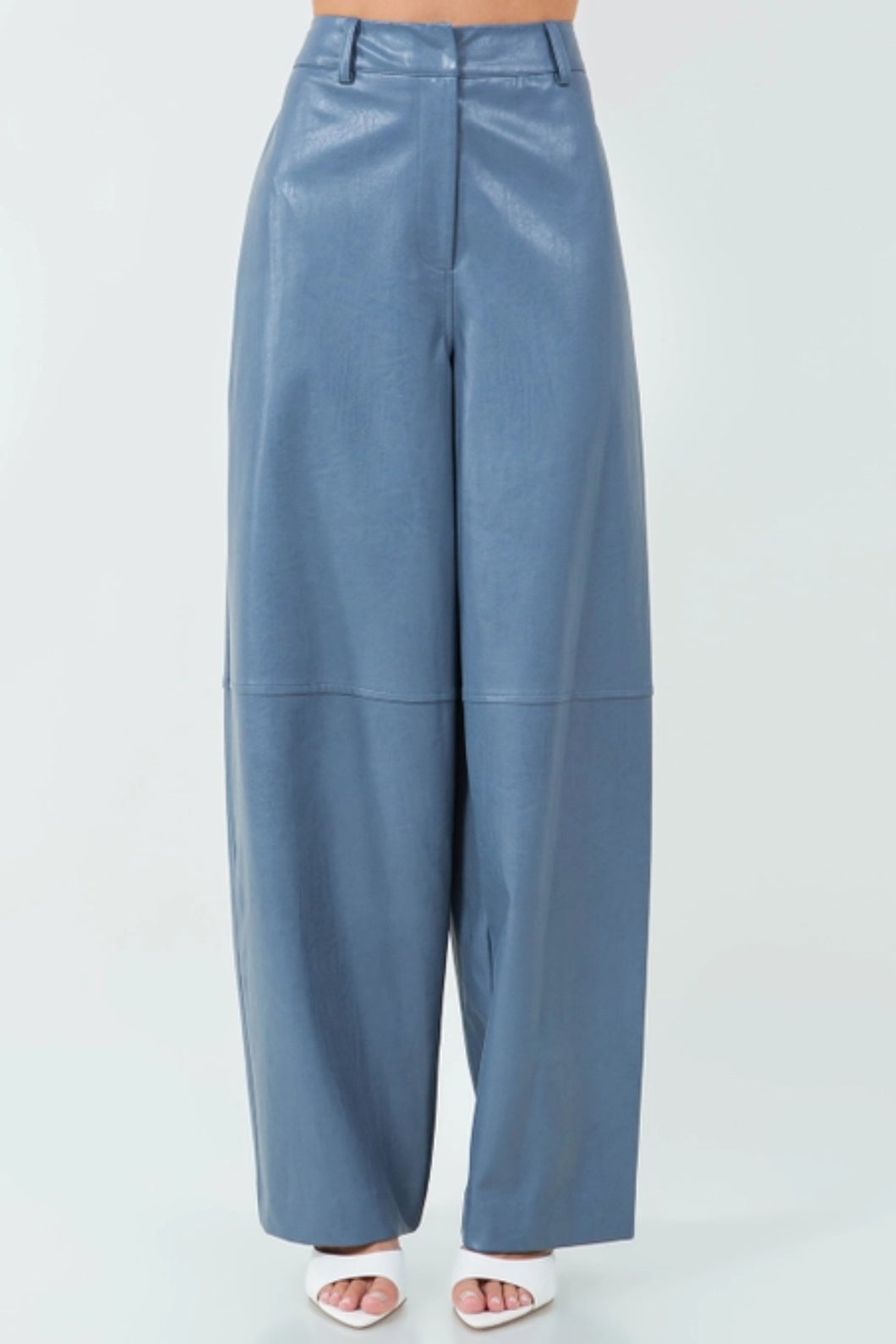 Introducing our Dusty Blue Loose Fit Vegan Leather Pants—a perfect blend of style and comfort. Crafted from high-quality vegan leather, these pants offer a soft, supple feel with a chic, relaxed silhouette. The loose fit provides ease of movement, making them ideal for both casual outings and dressed-up occasions. The unique dusty blue hue adds a modern twist to classic leather pants, ensuring you stand out in any crowd. 