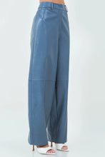 Load image into Gallery viewer, Introducing our Dusty Blue Loose Fit Vegan Leather Pants—a perfect blend of style and comfort. Crafted from high-quality vegan leather, these pants offer a soft, supple feel with a chic, relaxed silhouette. The loose fit provides ease of movement, making them ideal for both casual outings and dressed-up occasions. The unique dusty blue hue adds a modern twist to classic leather pants, ensuring you stand out in any crowd. 
