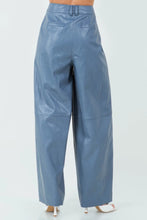 Load image into Gallery viewer, Introducing our Dusty Blue Loose Fit Vegan Leather Pants—a perfect blend of style and comfort. Crafted from high-quality vegan leather, these pants offer a soft, supple feel with a chic, relaxed silhouette. The loose fit provides ease of movement, making them ideal for both casual outings and dressed-up occasions. The unique dusty blue hue adds a modern twist to classic leather pants, ensuring you stand out in any crowd. 
