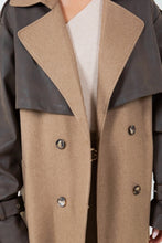 Load image into Gallery viewer, A long brown trench coat featuring a mix of vegan leather and traditional trench materials, offering a unique and chic style. 
