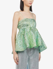 Load image into Gallery viewer, Introducing our Green Jacquard Peplum Top – a stylish and versatile wardrobe essential. Crafted from a luxurious jacquard fabric, this peplum top features self-tie straps for a customizable fit and a chic straight neckline. Elevate your look with this on-trend and sophisticated Green Jacquard Peplum Top, perfect for any occasion.
