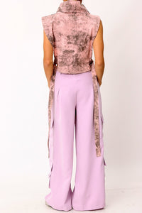 The Wide Leg Lavender Cargo Pants are comfortable, on trend and beautiful. The five utility pockets add dimension to this classic silhouette. Made of soft fabric, these pants feature a relaxed fit that fits like a dream. The utility pockets add function and the pretty lilac color adds a feminine touch. Wear them with heels for an evening out or flats for a casual day look. 